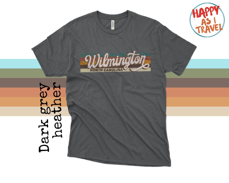 May include: Dark heather grey t-shirt with a vintage-style graphic that says "Wilmington, North Carolina".