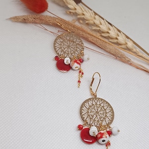 Golden dangling earrings, red and gold charms, sleepers