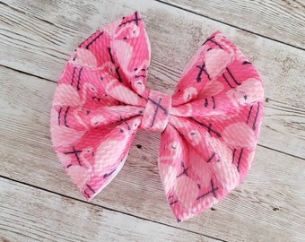 Tropical aqua blue green with pink flamingo print 4" Pin up hair bow clip Tropical aqua blue green with pink flamingo print 4" Pin up hair bow clip