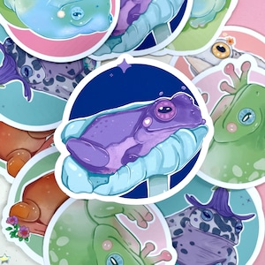 May include: A set of 10 frog stickers featuring different frog designs. The stickers are colorful and feature a variety of frog poses and expressions. The stickers are perfect for adding a touch of whimsy to your belongings.