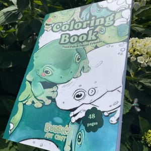 May include: A coloring book titled "Coloring Book Pond Pals & Forest Friends" with a green frog illustration. The cover also features the text "Bubbles Art Craft" and a sticker that says "48 pages".