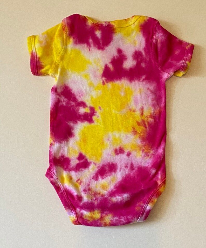 Yellow and pink onesie
