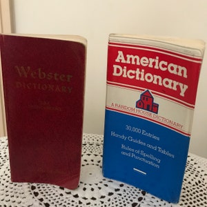 Two vintage pocket English dictionaries that provide word definitions and much more