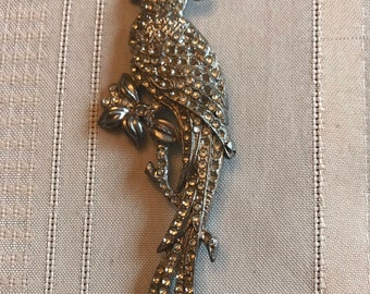 Stunning vintage 5 inch bird of paradise silver  brooch covered with clear rhinestones.