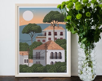 May include: A framed illustration of a village with houses and trees under a full moon. The houses are white with orange roofs and the trees are green. The sky is blue with a pink sunset.