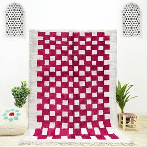 A sheepskin Beni Ourain Moroccan Red and White checkered rug