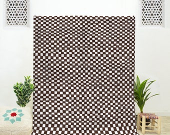 A shag Moroccan Beni Ourain Brown and White checkered rug