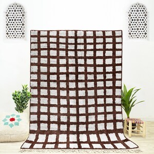 A shag Moroccan Beni Ourain Brown and White checkered rug