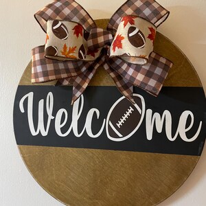 Football Door Decor; Welcome to our Home 15” Football Door Hanger; Welcome Door Sign; Front Door Decor; Indoor/Outdoor Door Hanger