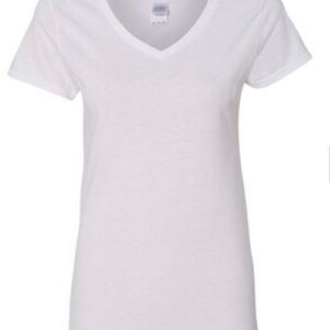 May include: A plain white v-neck t-shirt with short sleeves.