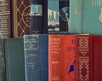 May include: A collection of vintage hardcover books with various colors and titles. The spines display titles like "Today's World," "Europe Since 1914," and "Collected Verse." The books are arranged closely together, creating a visually rich display.