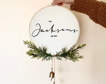 Custom 10” Family Name Hand Embroidered Wall Hanging, Wreath, Wall Decor, Greenery, Brass Bells, Minimal, Christmas, Winter, Personalized