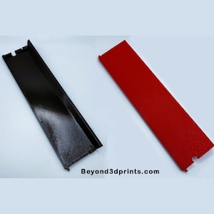May include: Two rectangular 3D-printed objects. One is black, with a channel and notched ends. The other is red, flat, and also has notched ends. The website "Beyond3dprints.com" is printed on the image.