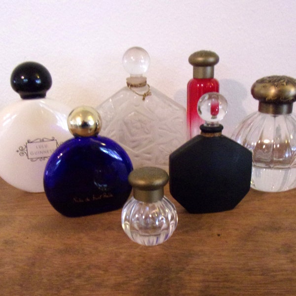 A Collection of Seven Assorted Empty Perfume Bottles Niki de Saint Phalle, JC Brousseau