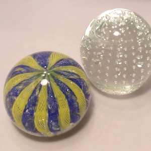 Two Heavy Glass Paperweights - John Gentile Controlled Bubble & Blue Yellow Ribbon Design