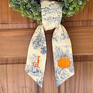 personalized autumn chinoiserie wreath sash, custom monogram orange pumpkin door swag, blue and white fall porch decor