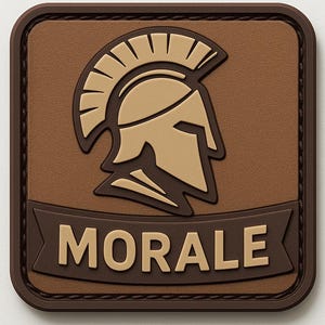 May include: A square patch with a brown background and a tan gladiator helmet design. The word "MORALE" is displayed in capital letters on a banner at the bottom of the patch. The patch has a dark brown border.