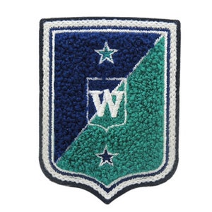 May include: A shield-shaped patch with a navy blue and teal design. The patch features a white embroidered border and a white letter "W" in the center. Two white stars are placed on the navy blue and teal sections.