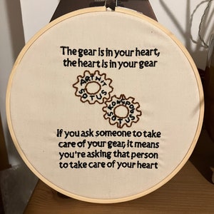 May include: Embroidered hoop art with the quote "The gear is in your heart, the heart is in your gear. If you ask someone to take care of your gear, it means you're asking that person to take care of your heart."