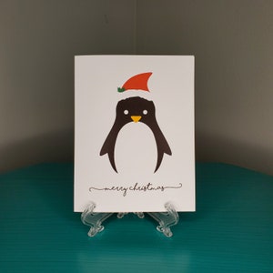 Carte de Noël minimaliste de pingouin