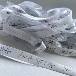 May include: White satin ribbon with black lettering that reads "Jessa Jo x Stella Boutique".