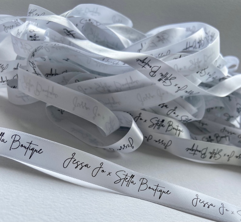 May include: White satin ribbon with black lettering that reads "Jessa Jo x Stella Boutique".