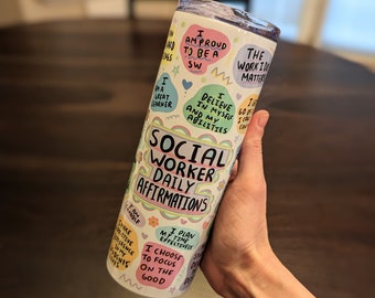 May include: A white stainless steel tumbler with a colorful design featuring affirmations for social workers. The text includes phrases like "I am proud to be a SW", "I believe in myself and my abilities", "The work I do matters", "I plan my time effectively", and "I choose to focus on the good".