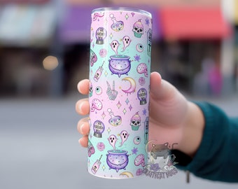 May include: A pink and blue stainless steel tumbler with a repeating pattern of ghosts, cauldrons, eyeballs, and the text "I see through you".