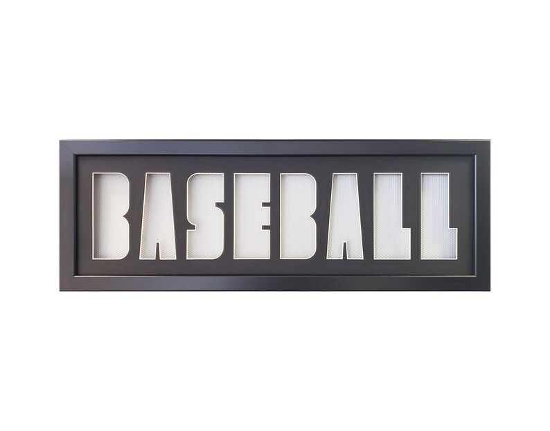 May include: Black framed shadow box with the word "BASEBALL" cut out in white.