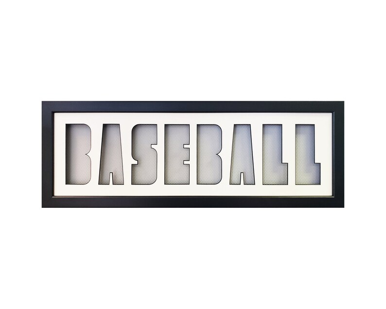 May include: A black framed sign with the word "BASEBALL" cut out of the white background. The letters are filled with a white mesh material.
