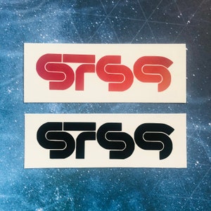 May include: Two stickers with the word "SRSS" written in a stylized font. The top sticker is red and the bottom sticker is black.