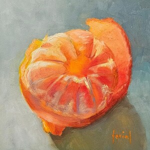 May include: An oil painting of a partially peeled orange tangerine with vibrant orange and yellow segments. The fruit is rendered with visible brushstrokes against a muted grey-blue background, featuring the artist's signature in orange at the bottom.