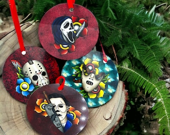 May include: Four round ornaments with horror movie characters painted on them. The ornaments are red, blue, green, and yellow. The characters include Jason Voorhees, Ghostface, Michael Myers, and Freddy Krueger.