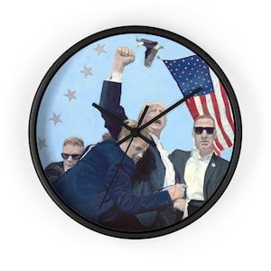 May include: A wall clock featuring a painting of four men, one with his fist raised in the air. The men are standing in front of an American flag with a bald eagle flying above. The background is a light blue sky with white stars.