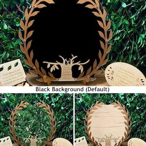 May include: A wooden memorial tree frame with a black background. The frame is decorated with a wreath of leaves and has a cutout of a tree with branches. The text "In Loving Memory of Edward Dandelion 1940-2026" is engraved on the tree. The frame is shown with a small wooden leaf that can be signed and placed inside the frame.