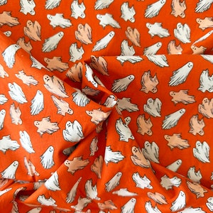 Halloween Glow in The Dark Ghosts on Orange 44" Wide 100% Cotton Quilting Fabric - Sold By the Yard