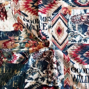May include: A colorful fabric with a woodland theme. It features images of a moose, deer, owl, pine cones, and a geometric pattern. The fabric has the text "Good Times Wildlife" printed on it.