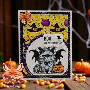 May include: Halloween-themed greeting card with a yellow background featuring witch hats and cauldrons. The card has a black border and a white oval with a grumpy cat illustration, a pumpkin, and the text "BOO. Or whatever."