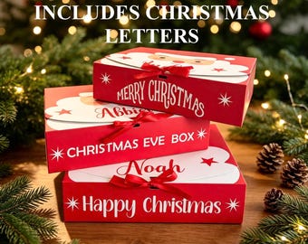 May include: Three rectangular red gift boxes stacked, each featuring a white Santa Claus face graphic, a red satin ribbon bow, and white text. The boxes are labeled Merry Christmas, Christmas Eve Box, and Happy Christmas with names included.