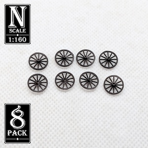 May include: Eight small, dark brown model wagon wheels. The wheels have a spoke design and are arranged on a white surface. The image includes text that reads "N SCALE 1:160" and "8 PACK".