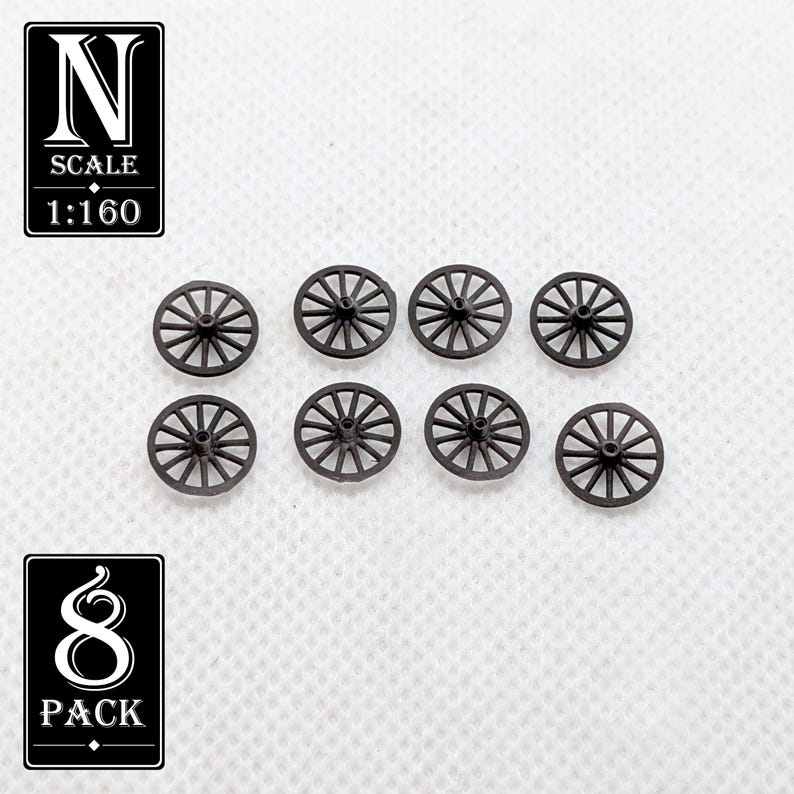 May include: Eight small, dark brown model wagon wheels. The wheels have a spoke design and are arranged on a white surface. The image includes text that reads "N SCALE 1:160" and "8 PACK".