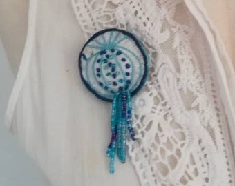 Brooch in embroidery and beads