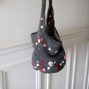 Handmade crocheted wool bag embroidered with flowers