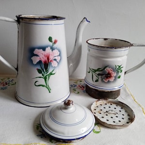 Antique enamelled sheet metal coffee pot decorated with carnation flowers