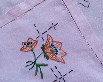 Vintage French hand embroidered tea tablecloth, stylized flowers on pink fabric