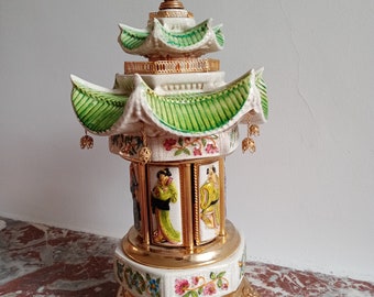 Reuge lipstick, cigarettes Carousel holder music box, chinese pagoda cappodimonte