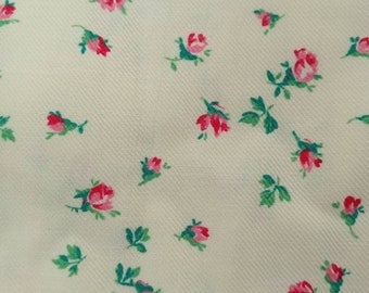 Large vintage flannel fabric coupon with pink flowers on a pale yellow background