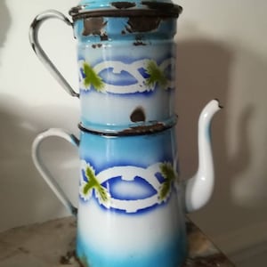 Antique enamelled sheet metal coffee pot with stylised blue decoration