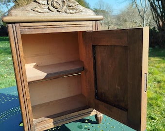 Vintage wooden apothecary cabinet with mirror