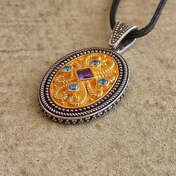 Pendant, made with inspiration of Byzantine art with aquamarine and amethyst cubic zirconia in gold plated and oxidized sterling silver 925